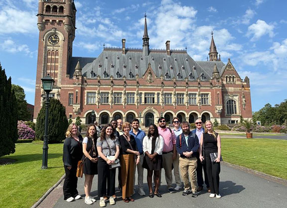 2026 Global Governance Summer School participants outside the Peace Palace, which is located in The Hague.