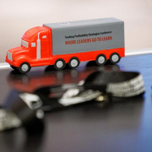 A toy big rig truck sits on a table.