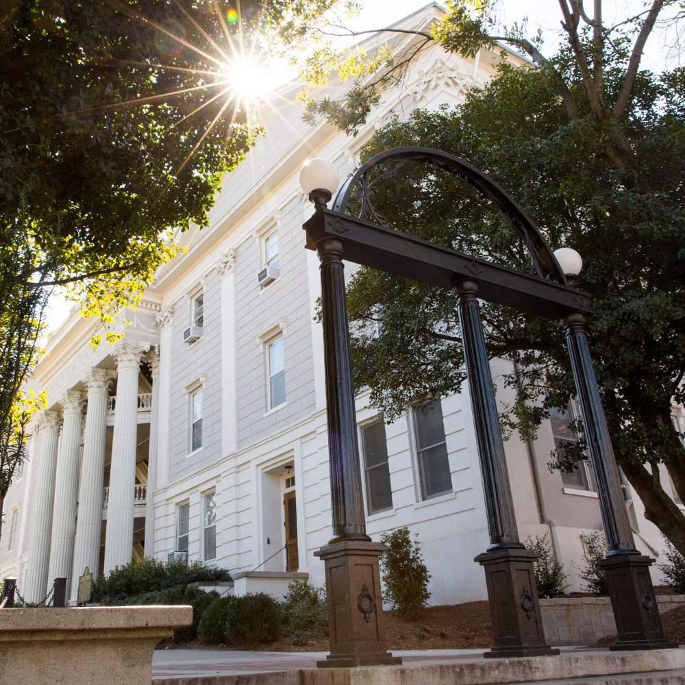 The Arch at sunrise in front of Holmes-Hunter Academic Building (UGA MarComms)