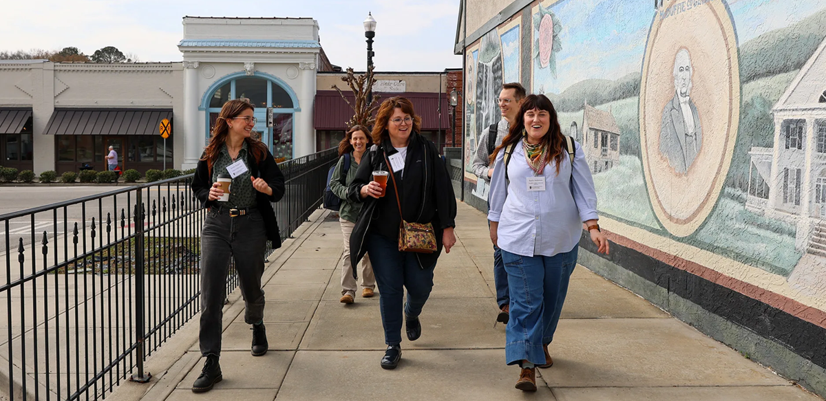Rural Engagement Workshop participants Sarah Haight, Sheri Dorn, Kayla Anderson, Rachael Green and Cameron Thomas explore downtown Thomson during a community visit to McDuffie County. (Photo by Beth Anne DeKeizer)